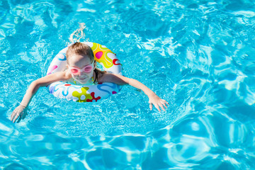 Little girl at swimming pool