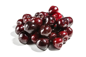 Pile of sweet cherry isolated on white background.