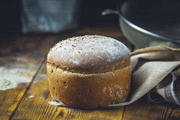 freshly baked bread on dark gray kitchen table
