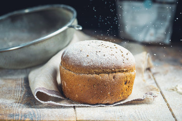 freshly baked bread on dark gray kitchen table Rustic style
