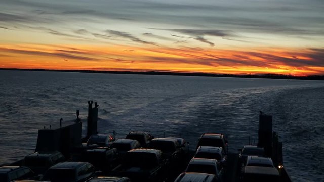 Ferry Full of Cars Crosses the Long Island Sound During Sunset