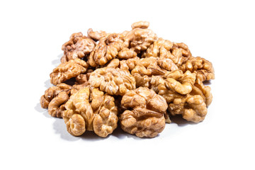 Pile of walnuts isolated on white background.