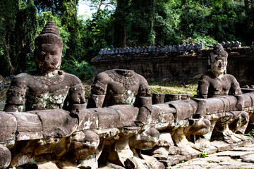 Fototapeta na wymiar Stone statues in Angkor Wat complex, Cambodia
