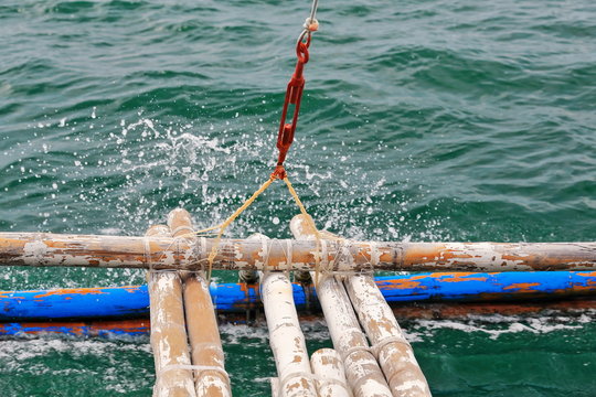 Bamboo outrigger projecting from a Filipino bangka boat-N.Bays Bay-Negros Oriental-Philippines.0527