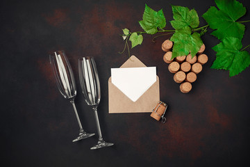 Naklejka na ściany i meble Gape bunch of cork with leaves, two wineglass, envelope and letter on rusty background.