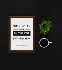 Motivational and inspirational quote. Wisdom quote. Wood frame with coffee on black background with quote. Minimal and elegant flat lay.