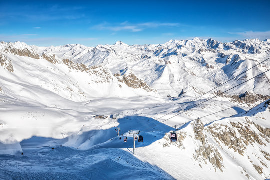 Stunning winter panorama in Tonale ski resort. View of Italian Alps from Adamelo Glacier, Italia, Europe.