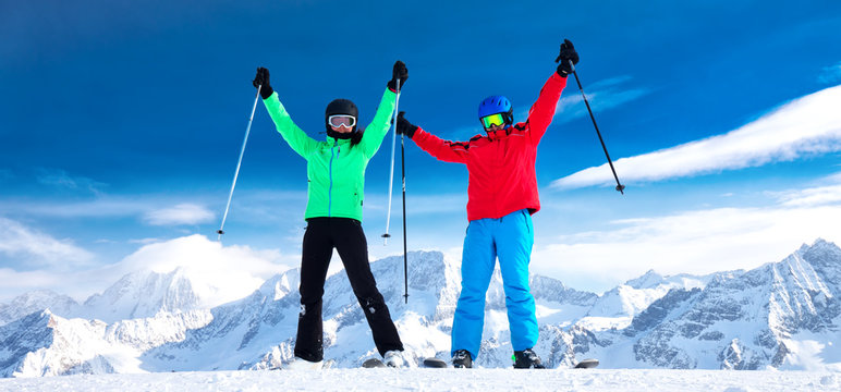 Young happy couple enjoying stunning view of Alps, Europe.