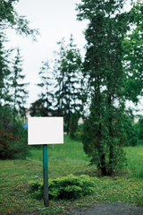 White plate in the park for inscriptions