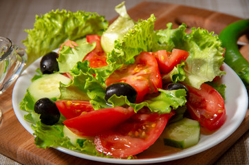 Fresh salad of tomatoes, olives and cucumbers