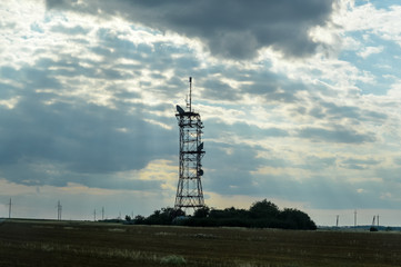 Telecommunication tower with the twilight sky.