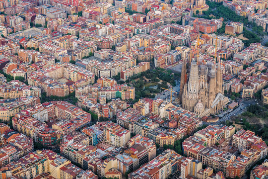 Barcelona aerial view of Eixample residencial district and Sagrada Familia, Spain