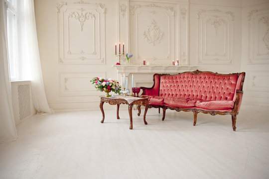 Baroque Style Interior With Red Luxury Sofa And Table In The Middle
