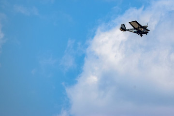 Small plane flying through clouds