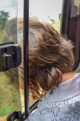 Fototapeta premium Woman looking out of car window