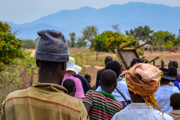 Family of villagers walking to church in Malawi, Africa