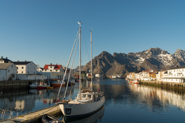 Fototapeta na wymiar At the fishing harbor of Henningsvaer at Lofoten Islands / Norway