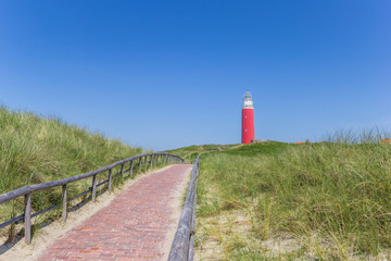 Fototapeta na wymiar Path leading to the lighthouse on Texel island, The Netherlands