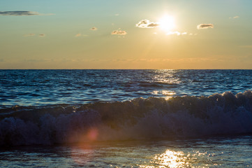 Amazing sea sunset, the sun, waves, clouds