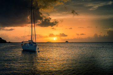 Sunset with a sailing boat in the Tobago cays - St-Vincent and the grenadines