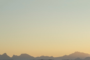 silhouette of red sea mountains on sunset