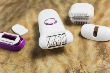 Depilator on a dark old background, concepts of female depilation at home