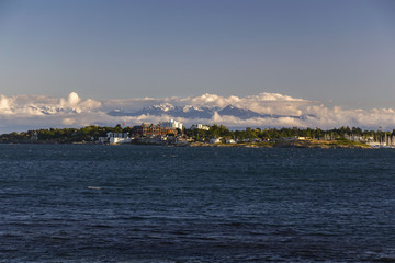 Scenic Landscape View of Oak Bay in Victoria on Vancouver Island with distant snowcapped peaks of...