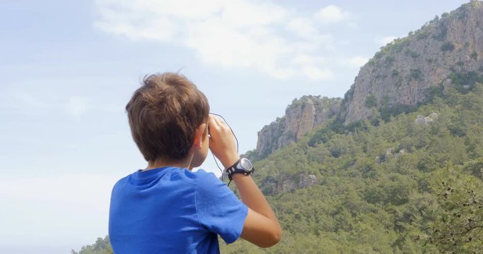 Boy looking at the mountains