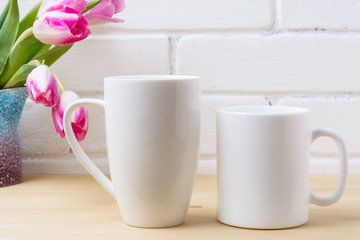 White coffee and cappuccino mug mockup with magenta tulip