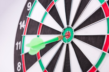 On the Target. Green dart hitting the target.