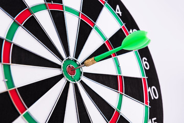 On the Target. Green dart hitting the target.