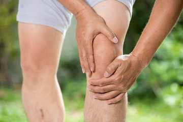 man with knee pain and feeling bad