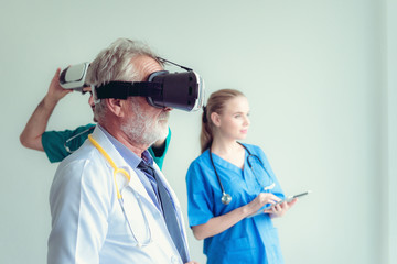 Portrait of doctor team are using virtual reality technology to examination physical body patient, Technology and occupational concept