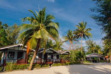 Fototapeta na wymiar Bungalows in hotel on a tropical beach