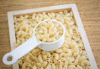 Elbow Macaroni or Gomiti Pasta in Measuring Cup