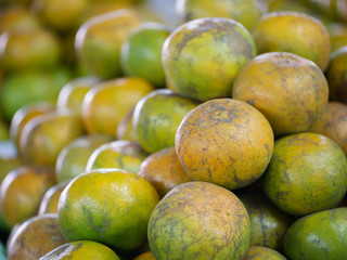 A lot of orange piles in a basket.