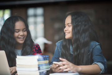 Group of happy friends student talking about knowledge in cafe