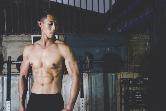 Strong Athletic Man showing muscel in local gym