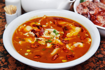 China Sichuan traditional cuisine - Boiled  fish in chili soup - obrazy, fototapety, plakaty