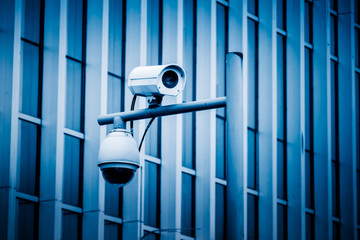 close-up view of security camera, in front of office building