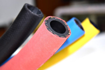 Flexible rubber cable on white background .rubber products .