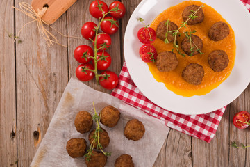 Meatballs with carrot purée.