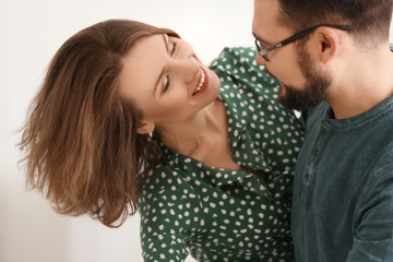 Lovely couple dancing together at home