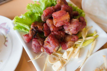 Special food pork spare rib fried Thai style on white dish.