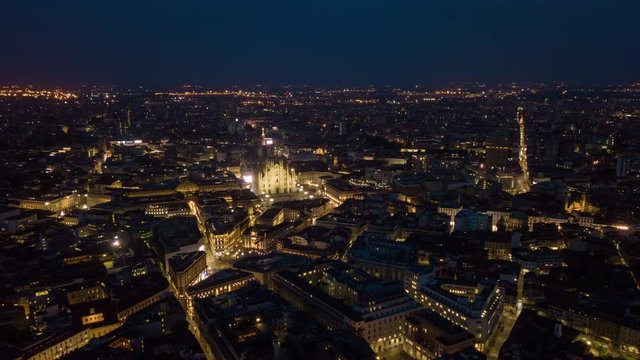 night illuminated malan city center aerial panorama 4k timelapse italy
