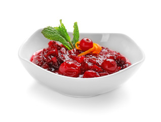 Bowl with tasty cranberry sauce and mint on white background