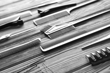 Professional hairdresser's tools on wooden background