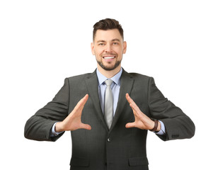 Young businessman holding something on white background