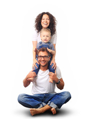 Happy young family laughing and smiling on light background