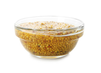 Dijon mustard in glass bowl on white background